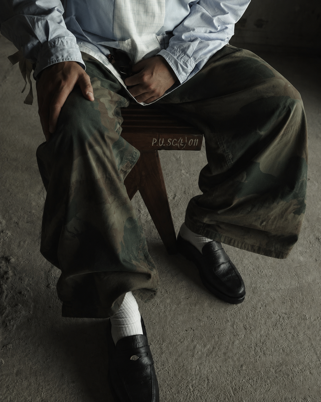 Relaxed wide camouflage trousers styled with black loafers