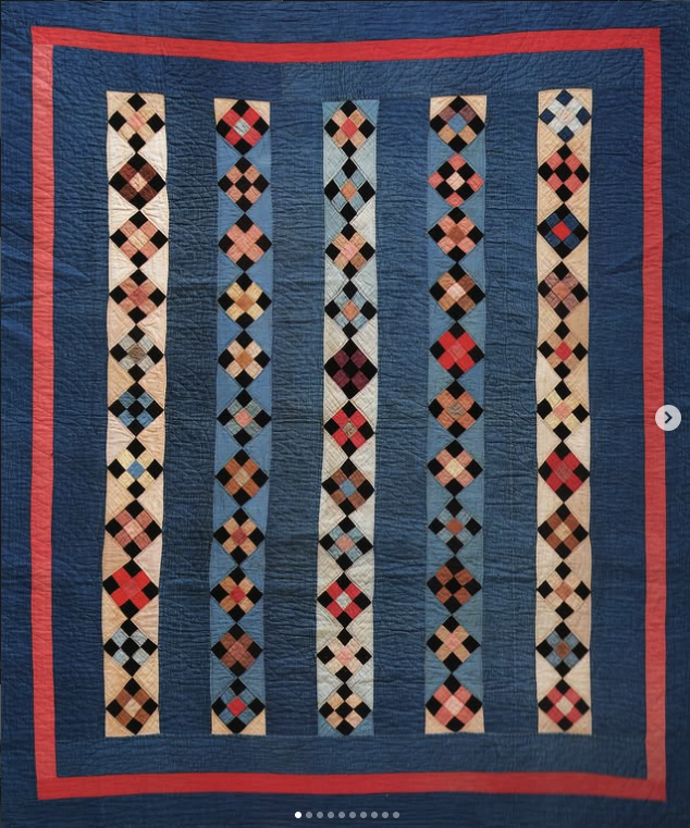 Blue quilt with vertical diamond patchwork rows
