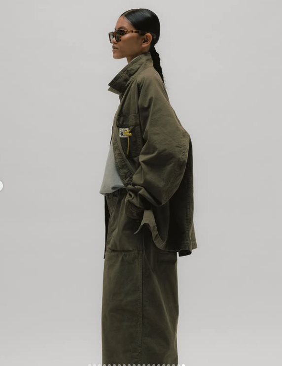 Side view of an olive oversized trouser silhouette